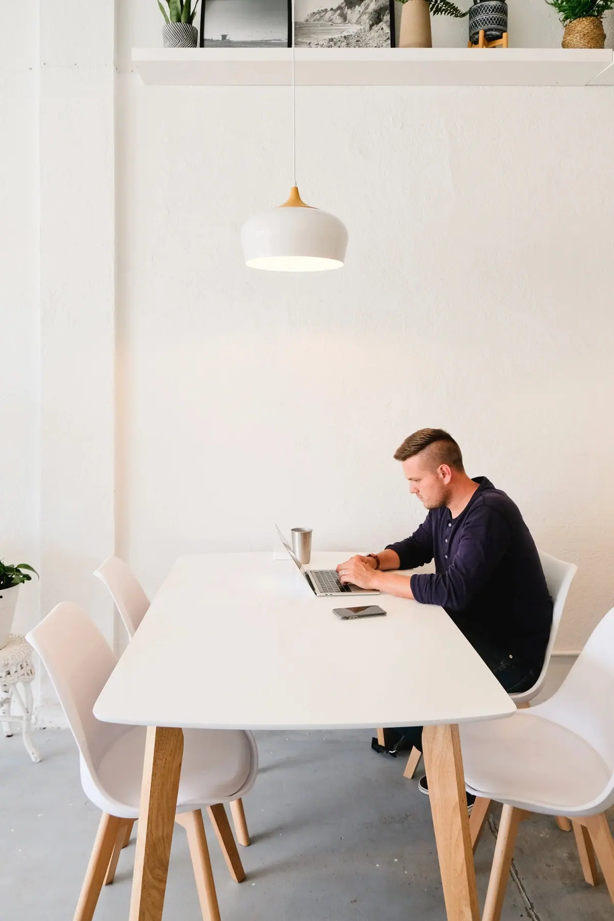 A member working at one of the two-person tables